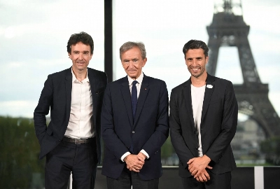 LVMH CEO Antoine Arnault (left), LVMH head Bernard Arnault (center) and Paris 2024 Organising Committee President Tony Estanguer pose at a news conference announcing the luxury titan as a premium sponsor of the Paris Games on Monday. LVMH CEO Antoine Arnault (left), LVMH head Bernard Arnault (center) and Paris 2024 Organising Committee President Tony Estanguer pose at a news conference announcing the luxury titan as a premium sponsor of the Paris Games on Monday.