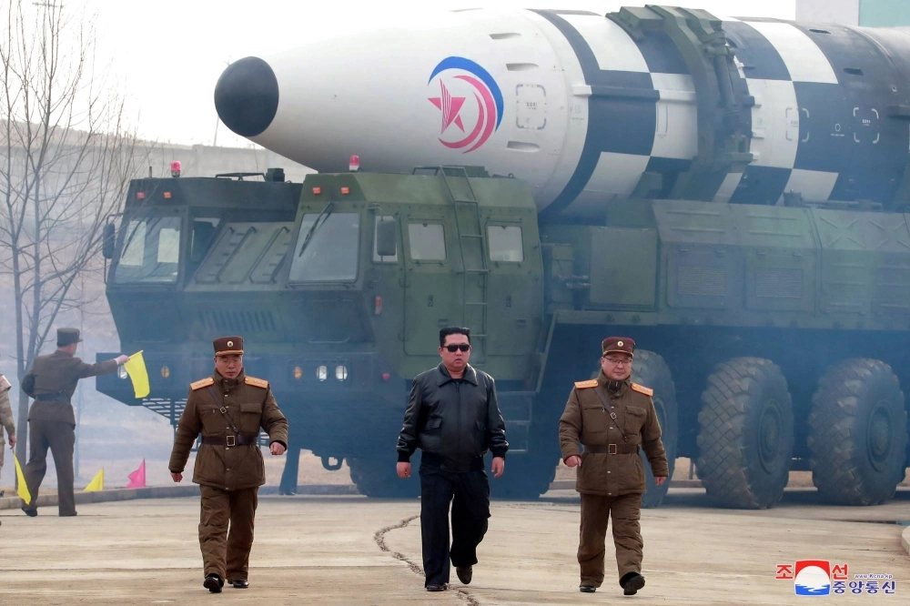 North Korean leader Kim Jong Un walks in front of an intercontinental ballistic missile in this undated photo released in March 2022. North Korean leader Kim Jong Un walks in front of an intercontinental ballistic missile in this undated photo released in March 2022.