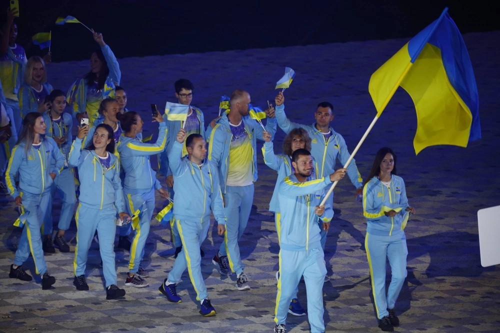 The Ukrainian delegation marches during the opening ceremony of the European Games in Krakow, Poland, on June 21. The Ukrainian delegation marches during the opening ceremony of the European Games in Krakow, Poland, on June 21.
