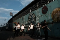 Pedestrians near Nakano station in Tokyo on July 10.  | Bloomberg
