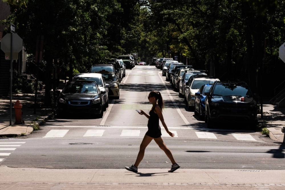 A pedestrian crosses a street during a heat wave in Philadelphia on Friday. Scientists suspect the last several years have been warmer than any point in more than 125,000 years. A pedestrian crosses a street during a heat wave in Philadelphia on Friday. Scientists suspect the last several years have been warmer than any point in more than 125,000 years.