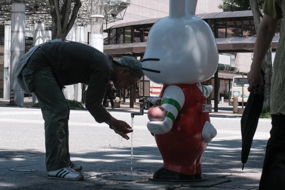 A man at a water faucet near Fukushima Station in the city of Fukushima, on July 6. A man at a water faucet near Fukushima Station in the city of Fukushima, on July 6.