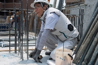 A construction worker at an apartment building site in Sumida Ward, Tokyo, on July 19. The workers were exposed to not only intense sunlight but also heat reflected by the concrete.  | Louise Claire WAGNER