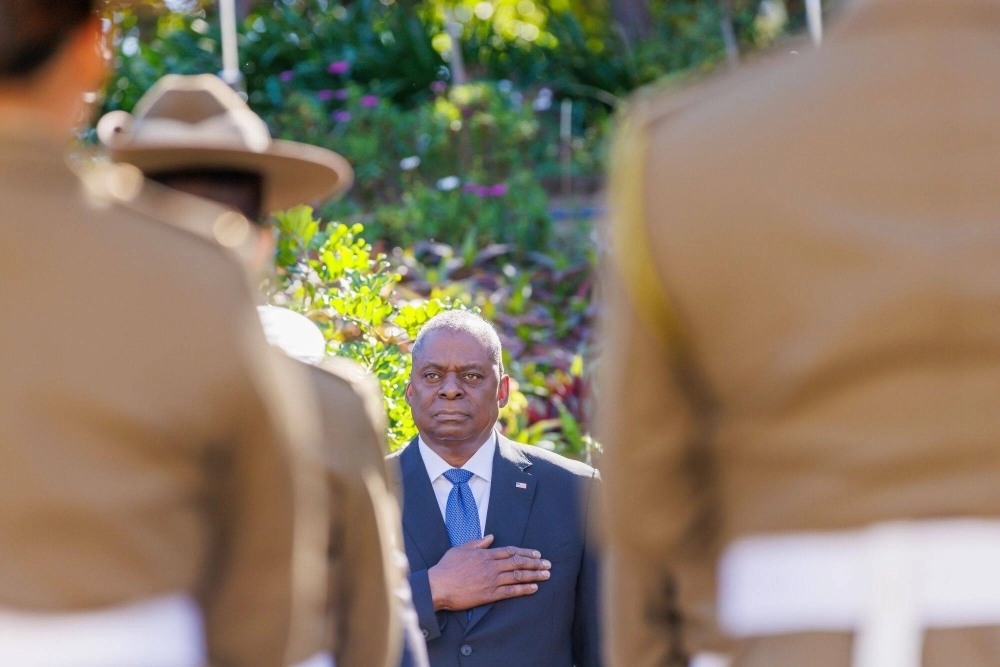 U.S. Defense Secretary Lloyd Austin stands for the U.S. national anthem before a meeting with his Australian counterpart ahead of the Australia-U.S. Ministerial Consultations in Brisbane on Friday. U.S. Defense Secretary Lloyd Austin stands for the U.S. national anthem before a meeting with his Australian counterpart ahead of the Australia-U.S. Ministerial Consultations in Brisbane on Friday.