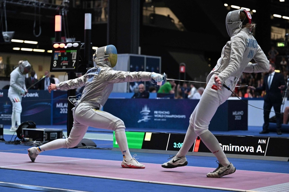 Ukrainian Olga Kharlan (left) and Russian Anna Smirnova compete during the women's sabre senior individual qualifiers at the FIE Fencing World Championships in Milan on Thursday. Ukrainian Olga Kharlan (left) and Russian Anna Smirnova compete during the women's sabre senior individual qualifiers at the FIE Fencing World Championships in Milan on Thursday.