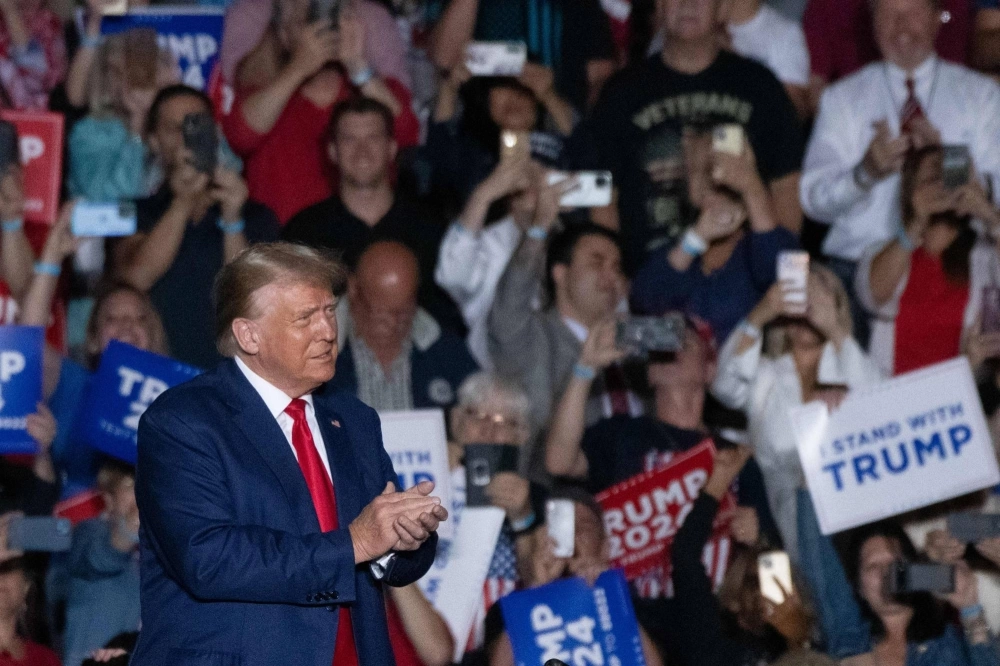 Former U.S. President and 2024 presidential hopeful Donald Trump attends one of his campaign rallies in Erie, Pennsylvania, on Saturday. Former U.S. President and 2024 presidential hopeful Donald Trump attends one of his campaign rallies in Erie, Pennsylvania, on Saturday.