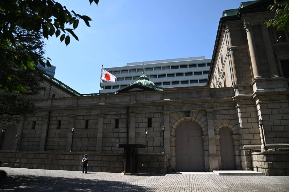The Bank of Japan headquarters in Tokyo. BOJ Deputy Gov. Shinichi Uchida has said there is still a long way to go before conditions fall into place for the bank to raise its short-term interest rate target. The Bank of Japan headquarters in Tokyo. BOJ Deputy Gov. Shinichi Uchida has said there is still a long way to go before conditions fall into place for the bank to raise its short-term interest rate target.