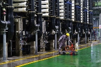 The Keppel Marina East Desalination Plant in Singapore on July 21. Public Utilities Board, which is responsible for Singapore's water management, has a long-term goal of reducing the energy use of water desalination to 1 killowatt-hours per 1,000 liters. | Bloomberg