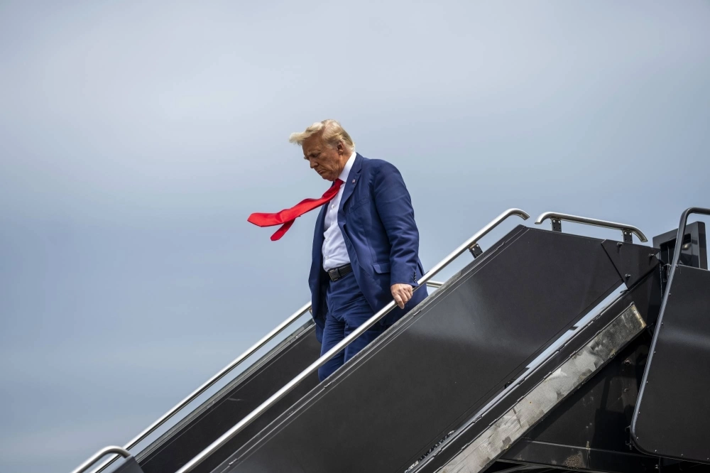 Former U.S. President Donald Trump, a candidate for the Republican presidential nomination, arrives at Reagan National Airport in Washington en route to his arraignment in federal court on Thursday. Former U.S. President Donald Trump, a candidate for the Republican presidential nomination, arrives at Reagan National Airport in Washington en route to his arraignment in federal court on Thursday.