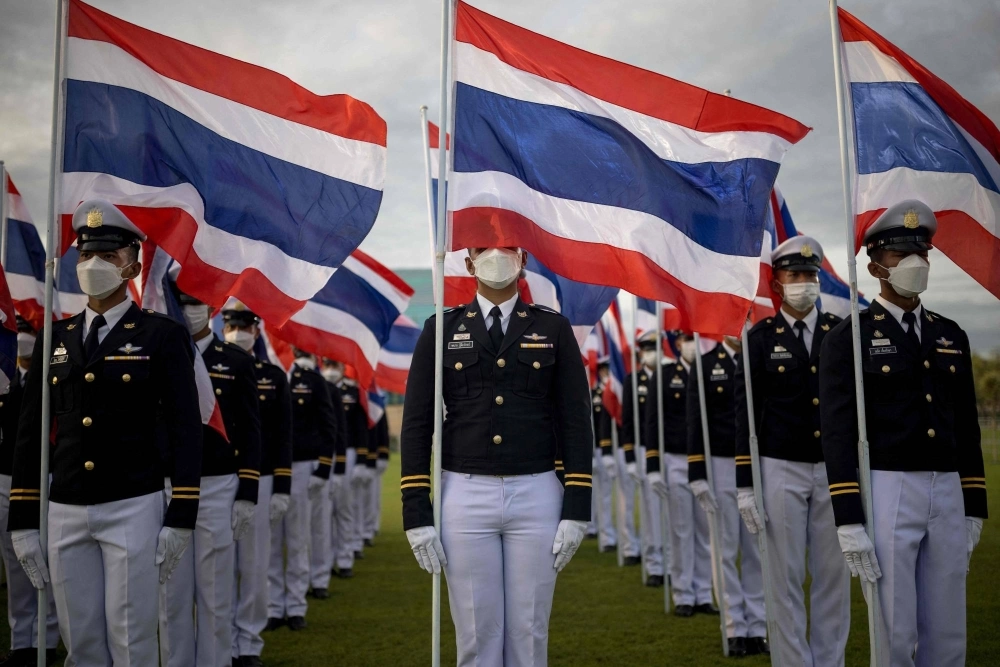 Members of the armed forces stand with flags of Thailand outside the Grand Palace during celebrations to mark King Maha Vajiralongkorn's 71st birthday in Bangkok on July 28. Members of the armed forces stand with flags of Thailand outside the Grand Palace during celebrations to mark King Maha Vajiralongkorn's 71st birthday in Bangkok on July 28.