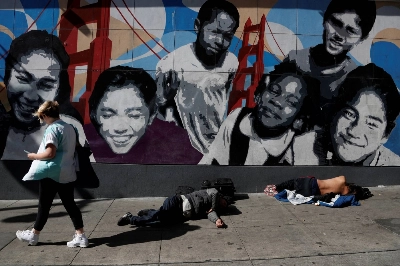 People lie passed out on a sidewalk in the Tenderloin district of San Francisco in February 2020. People lie passed out on a sidewalk in the Tenderloin district of San Francisco in February 2020.