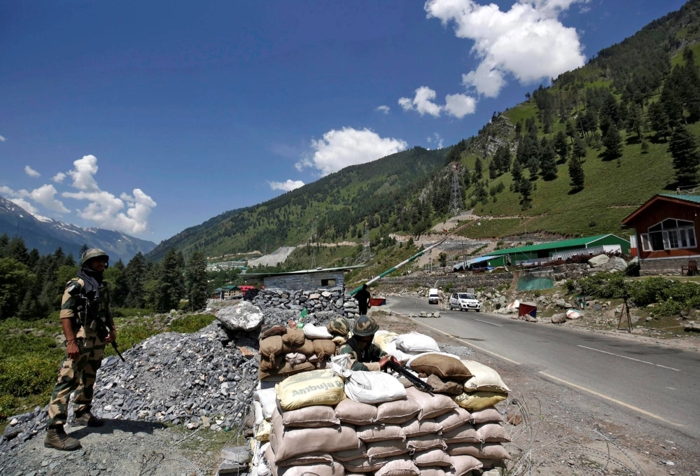 Indian border security force soldiers stand guard at a checkpoint along a highway leading to Ladakh in Kashmir's Ganderbal district in June 2020.   Indian border security force soldiers stand guard at a checkpoint along a highway leading to Ladakh in Kashmir's Ganderbal district in June 2020.