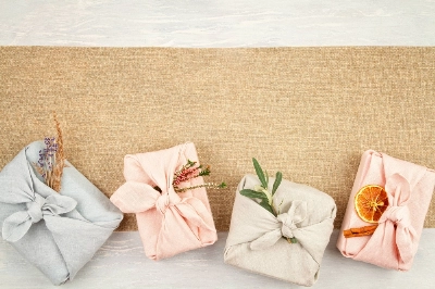 The "furoshiki" style of wrapping gifts takes advantage of a fabric that can be used more than once. The "furoshiki" style of wrapping gifts takes advantage of a fabric that can be used more than once.