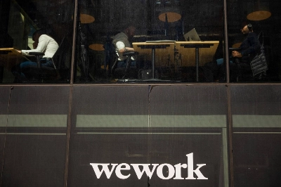 Workers at a WeWork coworking office in London Workers at a WeWork coworking office in London