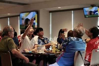 Nadeshiko Japan fans react during a watch party Friday at Saitama Stadium for the team's World Cup quarterfinal.  Nadeshiko Japan fans react during a watch party Friday at Saitama Stadium for the team's World Cup quarterfinal.