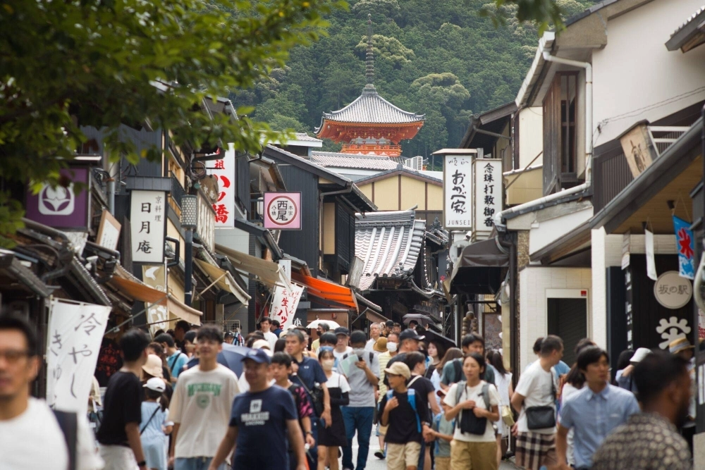 Tourists walk along the road that leads to Kiyomizu Temple in Kyoto on Friday. Tourists walk along the road that leads to Kiyomizu Temple in Kyoto on Friday.