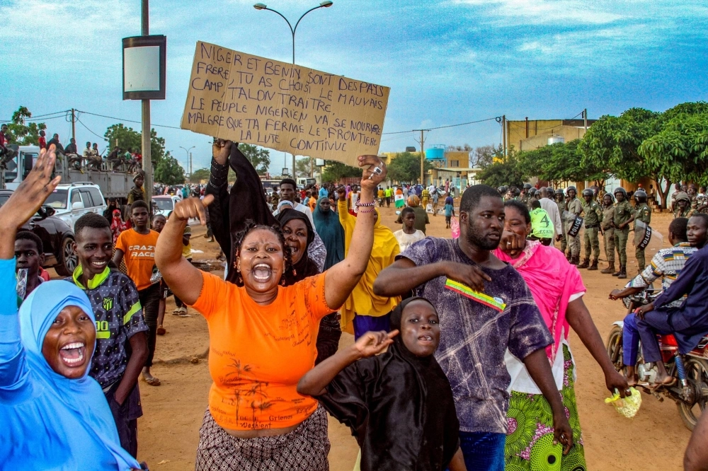 Niger's junta supporters take part in a demonstration in front of a French army base in Niamey, Niger, on Friday. Niger's junta supporters take part in a demonstration in front of a French army base in Niamey, Niger, on Friday.
