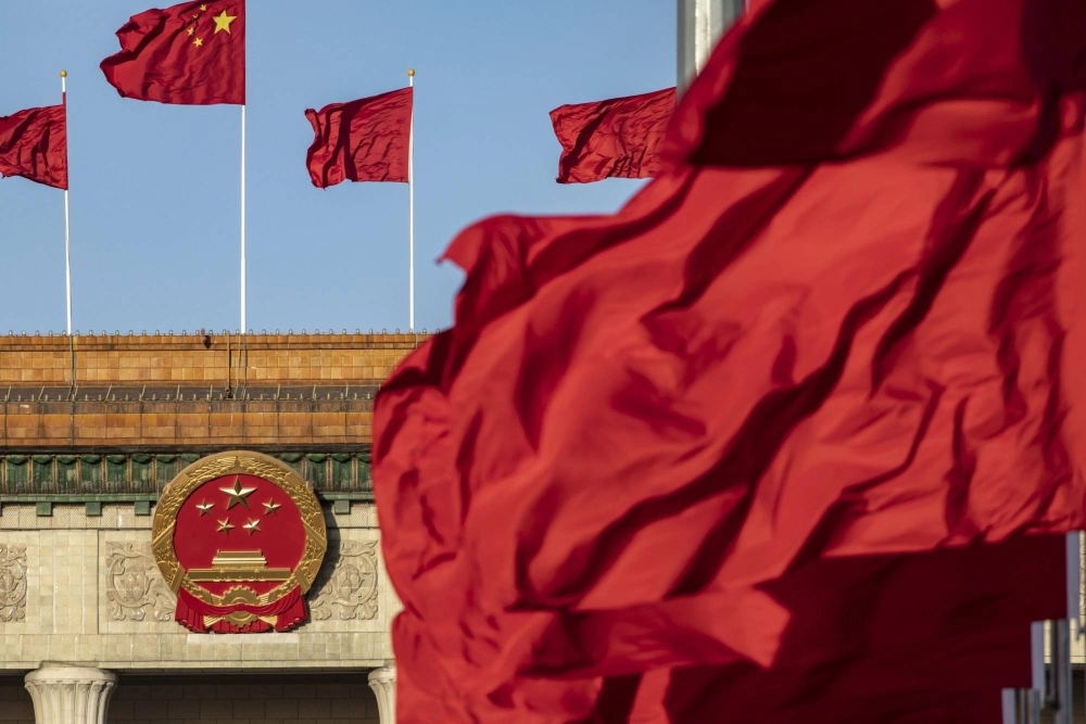 Chinese national flags fly over Tiananmen Square along with other red flags ahead of the fifth plenary session of the First Session of the 14th National People's Congress (NPC) at the Great Hall of the People in Beijing on March 12. Chinese national flags fly over Tiananmen Square along with other red flags ahead of the fifth plenary session of the First Session of the 14th National People's Congress (NPC) at the Great Hall of the People in Beijing on March 12.