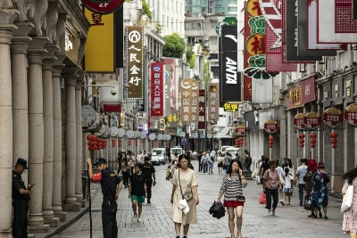 Pedestrians pass stores in Guangzhou. Economists say China needs measures to boost consumption and business confidence, but add that unlike previous slowdowns, there is no quick fix. Pedestrians pass stores in Guangzhou. Economists say China needs measures to boost consumption and business confidence, but add that unlike previous slowdowns, there is no quick fix.