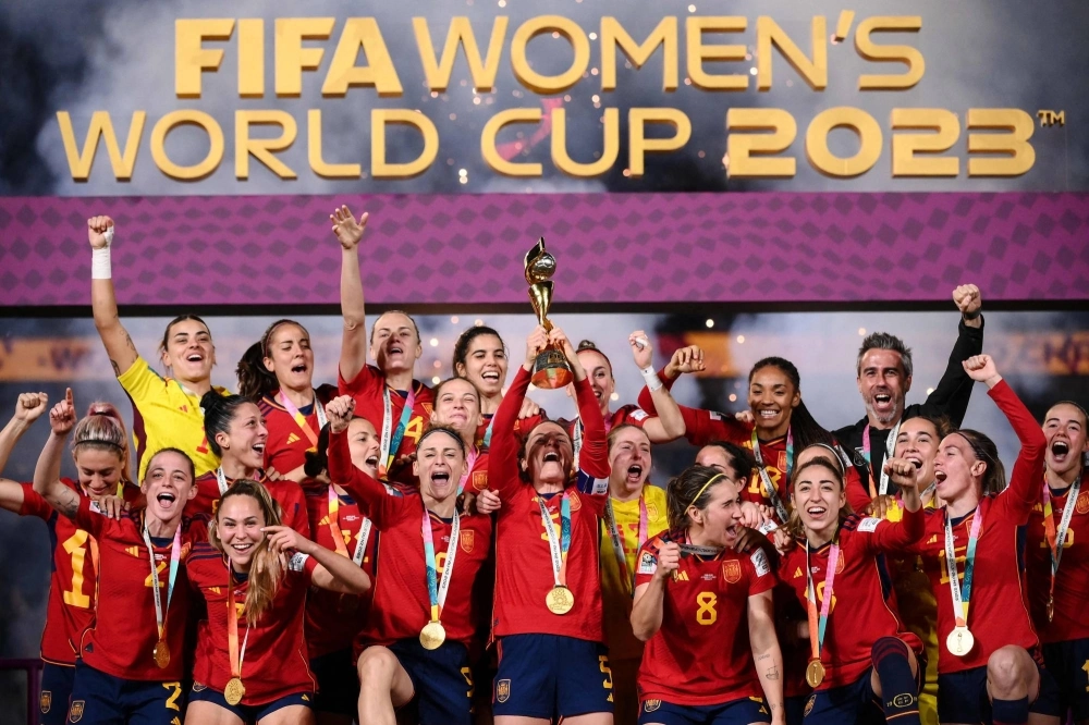 Spain's players celebrate with the trophy after winning the 2023 FIFA Women's World Cup final in Sydney on Sunday. Spain's players celebrate with the trophy after winning the 2023 FIFA Women's World Cup final in Sydney on Sunday.
