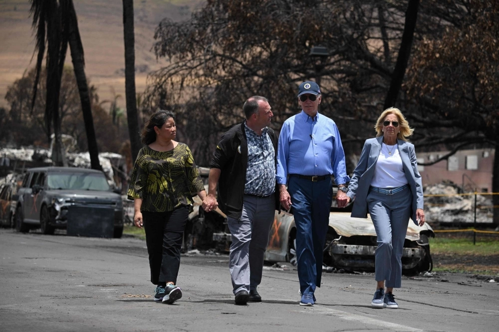 U.S. President Joe Biden (second from rigt), U.S. first lady Jill Biden (right), Hawaii Gov. Josh Green (second from left) and Jaime Green, first lady of Hawaii, visit an area devastated by wildfires in Lahaina, Hawaii, on Monday. U.S. President Joe Biden (second from rigt), U.S. first lady Jill Biden (right), Hawaii Gov. Josh Green (second from left) and Jaime Green, first lady of Hawaii, visit an area devastated by wildfires in Lahaina, Hawaii, on Monday.