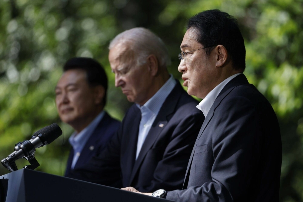 Prime Minister Fumio Kishida, U.S. President Joe Biden and South Korean leader Yoon Suk-yeol attend a news conference during a trilateral summit at Camp David, Maryland, on Friday. Prime Minister Fumio Kishida, U.S. President Joe Biden and South Korean leader Yoon Suk-yeol attend a news conference during a trilateral summit at Camp David, Maryland, on Friday.