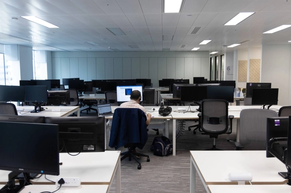 An office worker in London. A new report found that 36% of so-called workpoints — cubicles and desks — are never occupied, "indicating a general oversupply.” An office worker in London. A new report found that 36% of so-called workpoints — cubicles and desks — are never occupied, "indicating a general oversupply.”