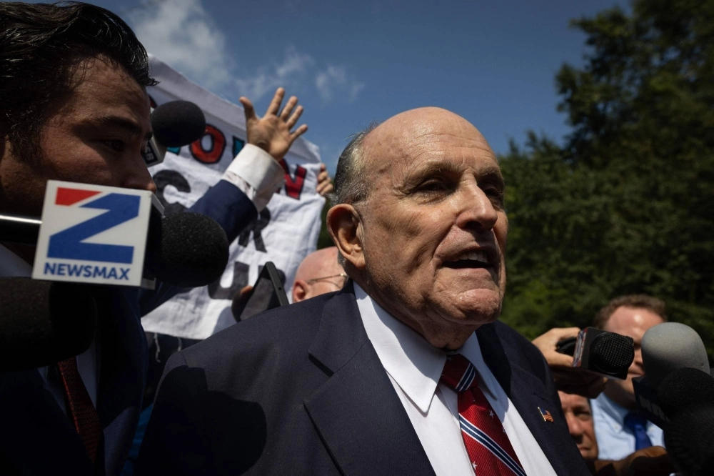 Rudy Giuliani, a former New York City mayor and attorney of former U.S. President Donald Trump, outside the Fulton County Jail in Atlanta on Wednesday after he surrendered to authorities Rudy Giuliani, a former New York City mayor and attorney of former U.S. President Donald Trump, outside the Fulton County Jail in Atlanta on Wednesday after he surrendered to authorities