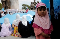 Ethnic Uyghurs protest against Chinese oppression at a rally in Istanbul in August 2022.   | REUTERS