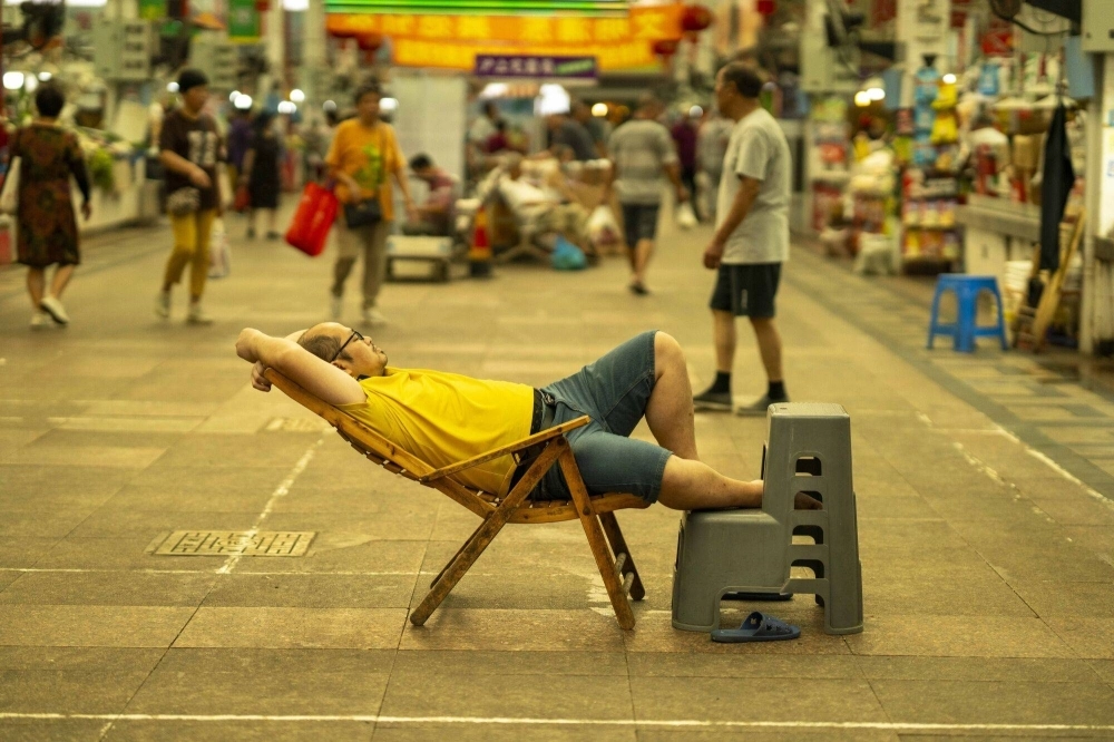 A man rests at a fresh food market in Shanghai, China, in early August. The world's second largest economy was meant to drive a third of global growth this year, so its dramatic slowdown in recent months is sounding alarm bells across the world. A man rests at a fresh food market in Shanghai, China, in early August. The world's second largest economy was meant to drive a third of global growth this year, so its dramatic slowdown in recent months is sounding alarm bells across the world.