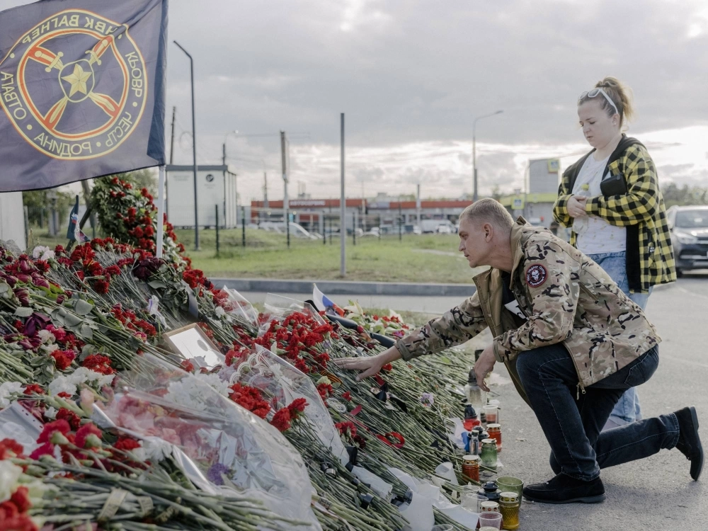 A man in a jacket with a Wagner patch visits an impromptu memorial to Yevgeny Prigozhin and other Wagner "heroes,” near the mercenary group’s headquarters in St. Petersburg, Russia, on Tuesday. A man in a jacket with a Wagner patch visits an impromptu memorial to Yevgeny Prigozhin and other Wagner "heroes,” near the mercenary group’s headquarters in St. Petersburg, Russia, on Tuesday.