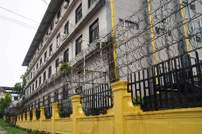 Barbed wire fences are seen outside a shuttered Great Wall Park compound where Cambodian authorities said they had recovered evidence of human trafficking, kidnapping and torture during raids on suspected cybercrime compounds in the coastal city of Sihanoukville, Cambodia, last September. Barbed wire fences are seen outside a shuttered Great Wall Park compound where Cambodian authorities said they had recovered evidence of human trafficking, kidnapping and torture during raids on suspected cybercrime compounds in the coastal city of Sihanoukville, Cambodia, last September.
