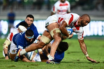 Japan's Michael Leitch attempts to break free during a match against Italy in Treviso, Italy, on Aug. 26. Japan's Michael Leitch attempts to break free during a match against Italy in Treviso, Italy, on Aug. 26.
