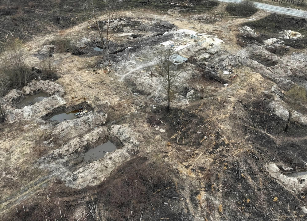 Trenches dug by the Russian military are seen in an area with high levels of radiation called the Red Forest, near the Chernobyl nuclear power plant, in Ukraine in April 2022. Russian troops reportedly picked up radioactive materials in the area around the plant without using protection against radiation. Trenches dug by the Russian military are seen in an area with high levels of radiation called the Red Forest, near the Chernobyl nuclear power plant, in Ukraine in April 2022. Russian troops reportedly picked up radioactive materials in the area around the plant without using protection against radiation.