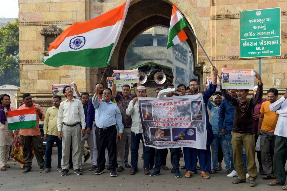 Indians celebrate the successful lunar landing of the Chandrayaan-3 spacecraft on the south pole of the moon at a rally in the city of Ahmedabad on Aug. 24. Indians celebrate the successful lunar landing of the Chandrayaan-3 spacecraft on the south pole of the moon at a rally in the city of Ahmedabad on Aug. 24.