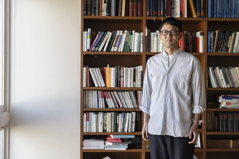 Kohei Saito, a philosophy professor at the University of Tokyo who appears regularly in Japanese media to discuss his ideas, at home in Tokyo on March 16. Kohei Saito, a philosophy professor at the University of Tokyo who appears regularly in Japanese media to discuss his ideas, at home in Tokyo on March 16.