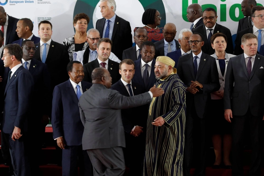 French President Emmanuel Macron (center) and deposed president Ali Bongo of Gabon (center left) at an African Union-European Union summit in 2017 French President Emmanuel Macron (center) and deposed president Ali Bongo of Gabon (center left) at an African Union-European Union summit in 2017