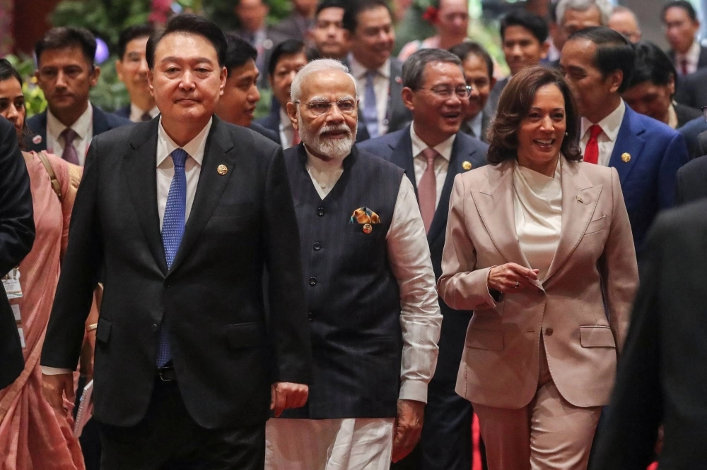 South Korean President Yoon Suk-yeol (left), Indian Prime Minister Narendra Modi (center), Chinese Premier Li Qiang (back, second right), U.S. Vice President Kamala Harris (front right) and Indonesian President Joko Widodo (back right) arrive for the East Asia Summit as part of Association of Southeast Asian Nations meetings in Jakarta on Thursday. South Korean President Yoon Suk-yeol (left), Indian Prime Minister Narendra Modi (center), Chinese Premier Li Qiang (back, second right), U.S. Vice President Kamala Harris (front right) and Indonesian President Joko Widodo (back right) arrive for the East Asia Summit as part of Association of Southeast Asian Nations meetings in Jakarta on Thursday.