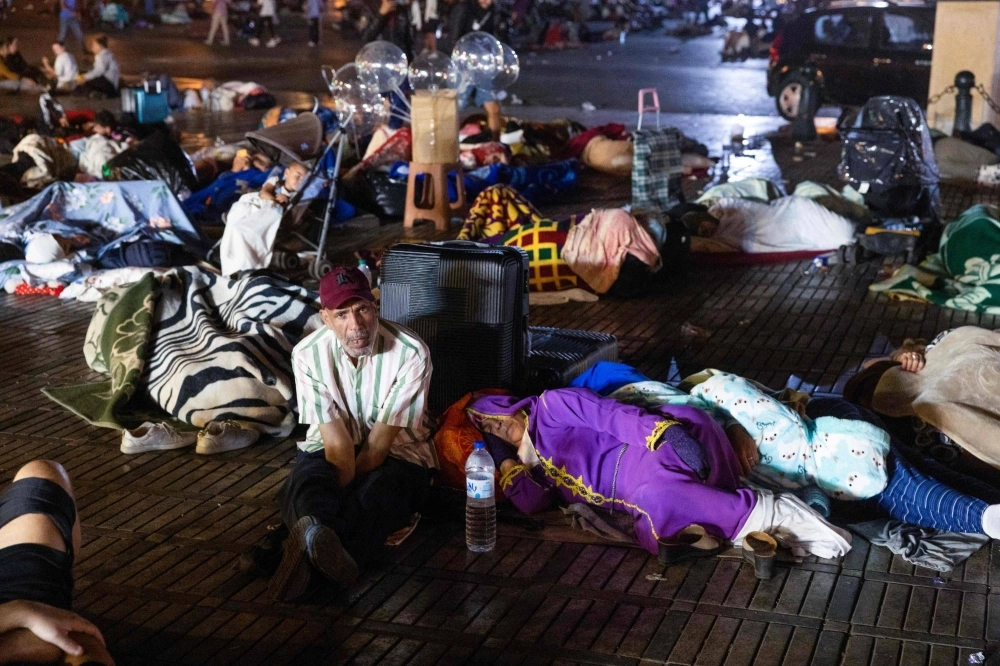 Residents take shelter outside at a square following a powerful earthquake in Marrakesh, Morocco, on Saturday. Residents take shelter outside at a square following a powerful earthquake in Marrakesh, Morocco, on Saturday.