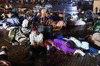 Residents take shelter outside at a square following a powerful earthquake in Marrakesh, Morocco, on Saturday. | AFP-JIJI