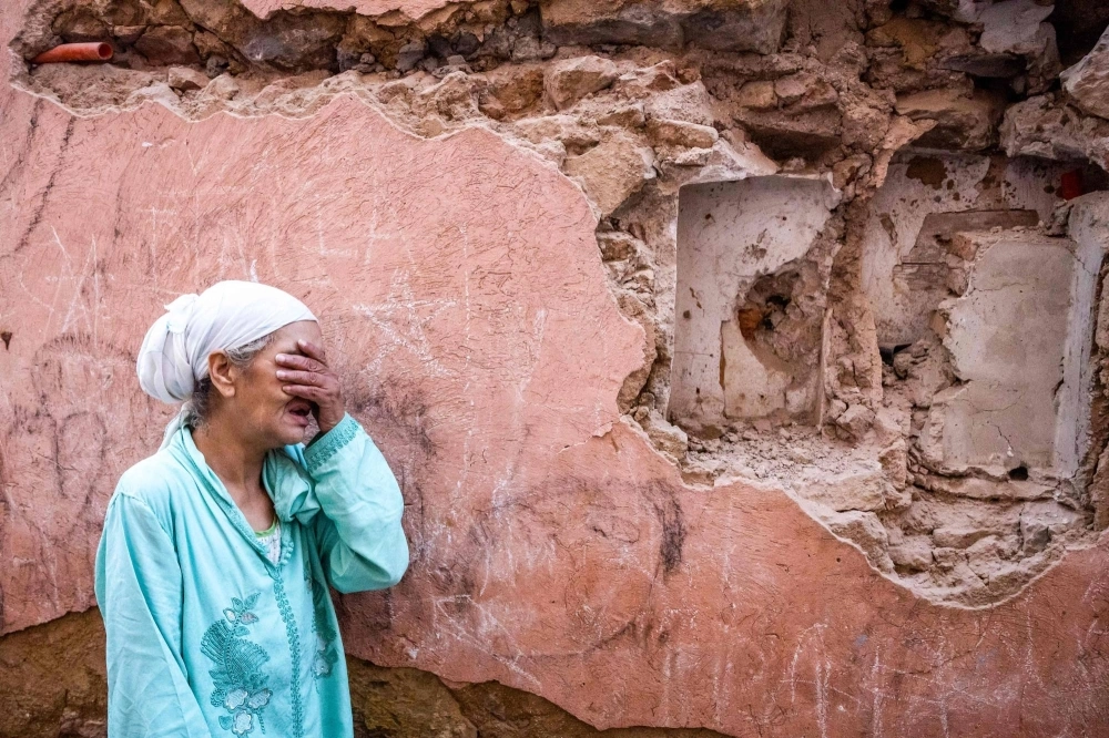 A woman in front of her earthquake-damaged house in the old city in Marrakesh on Saturday A woman in front of her earthquake-damaged house in the old city in Marrakesh on Saturday