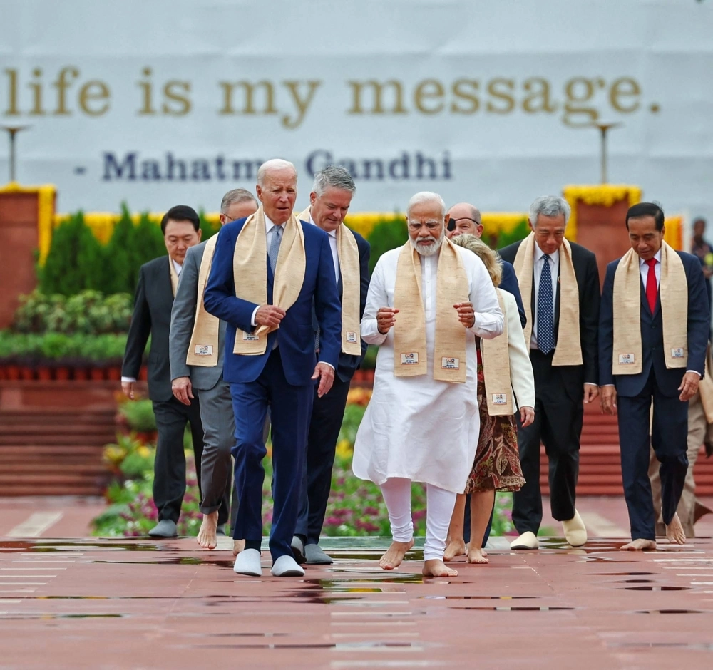 Indian Prime Minister Narendra Modi, U.S. President Joe Biden and other Group of 20 leaders arrive to pay their respects at the Mahatma Gandhi memorial in New Delhi on Sunday. Indian Prime Minister Narendra Modi, U.S. President Joe Biden and other Group of 20 leaders arrive to pay their respects at the Mahatma Gandhi memorial in New Delhi on Sunday.