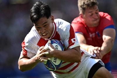 Japan center Ryoto Nakamura (left) breaks through to score the team's fifth try during its 2023 Rugby World Cup Pool D opener against Chile in Toulouse, France, on Sunday. Japan center Ryoto Nakamura (left) breaks through to score the team's fifth try during its 2023 Rugby World Cup Pool D opener against Chile in Toulouse, France, on Sunday.