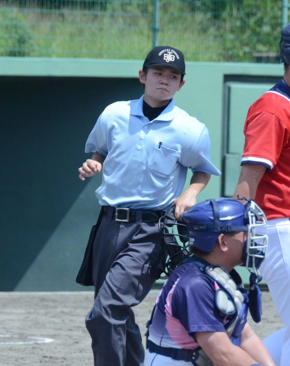 Ren Matsumoto, 18, serves as an umpire at a baseball game. Ren Matsumoto, 18, serves as an umpire at a baseball game.