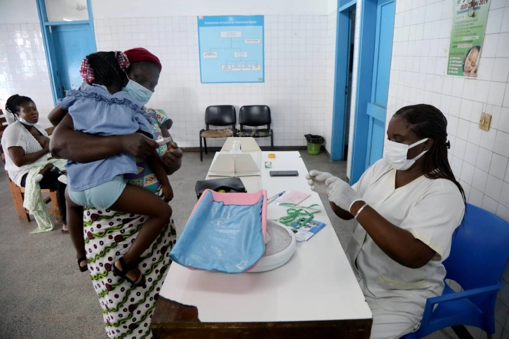 A nurse prepares to take care of a child with malaria at a hospital in Abidjan, Ivory Coast. A nurse prepares to take care of a child with malaria at a hospital in Abidjan, Ivory Coast.