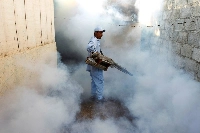 A health ministry worker fumigates a house to kill mosquitoes and curb the spread of dengue, chikungunya and Zika in Managua, Nicaragua. | REUTERS