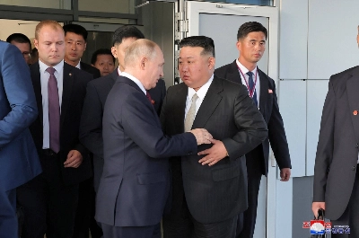 North Korea's leader Kim Jong Un (front right) exchanging farewell greetings with Russia's President Vladimir Putin (front left) at the Vostochny Cosmodrome in Russia's Amur region on Thursday. North Korea's leader Kim Jong Un (front right) exchanging farewell greetings with Russia's President Vladimir Putin (front left) at the Vostochny Cosmodrome in Russia's Amur region on Thursday.