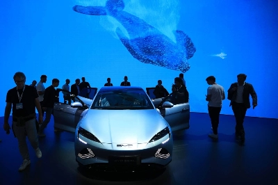 Visitors inspect a BYD electric sedan at a motor show in Munich Visitors inspect a BYD electric sedan at a motor show in Munich