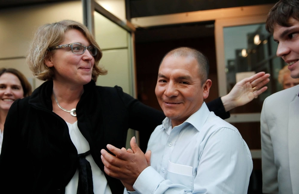 Peruvian farmer Saul Luciano Lliuya (center) reacts after a high regional German court ruled against RWE, one of Europe's biggest electricity companies, in Hamm, Germany, in November 2017. Peruvian farmer Saul Luciano Lliuya (center) reacts after a high regional German court ruled against RWE, one of Europe's biggest electricity companies, in Hamm, Germany, in November 2017.
