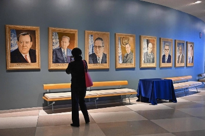 A visitor looks at portraits of former United Nations Secretaries-General at U.N. headquarters ahead of the 78th session of the United Nations General Assembly in New York on Friday. A visitor looks at portraits of former United Nations Secretaries-General at U.N. headquarters ahead of the 78th session of the United Nations General Assembly in New York on Friday.